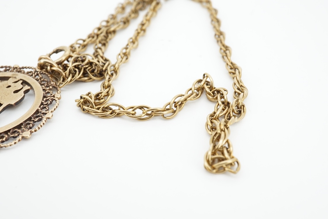 A modern 9ct gold Star of David pendant, diameter 22mm, a 9ct gold St Christopher's pendant on a 9ct chain and an Italian Uno-A-Erre 9k Mercedes insignia keyring, gross weight 22.2 grams.